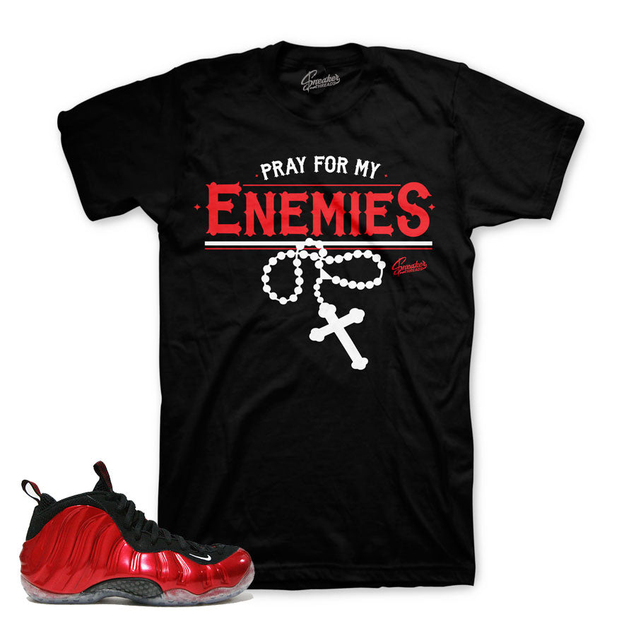 Metallic red foamposite tee match shoes.