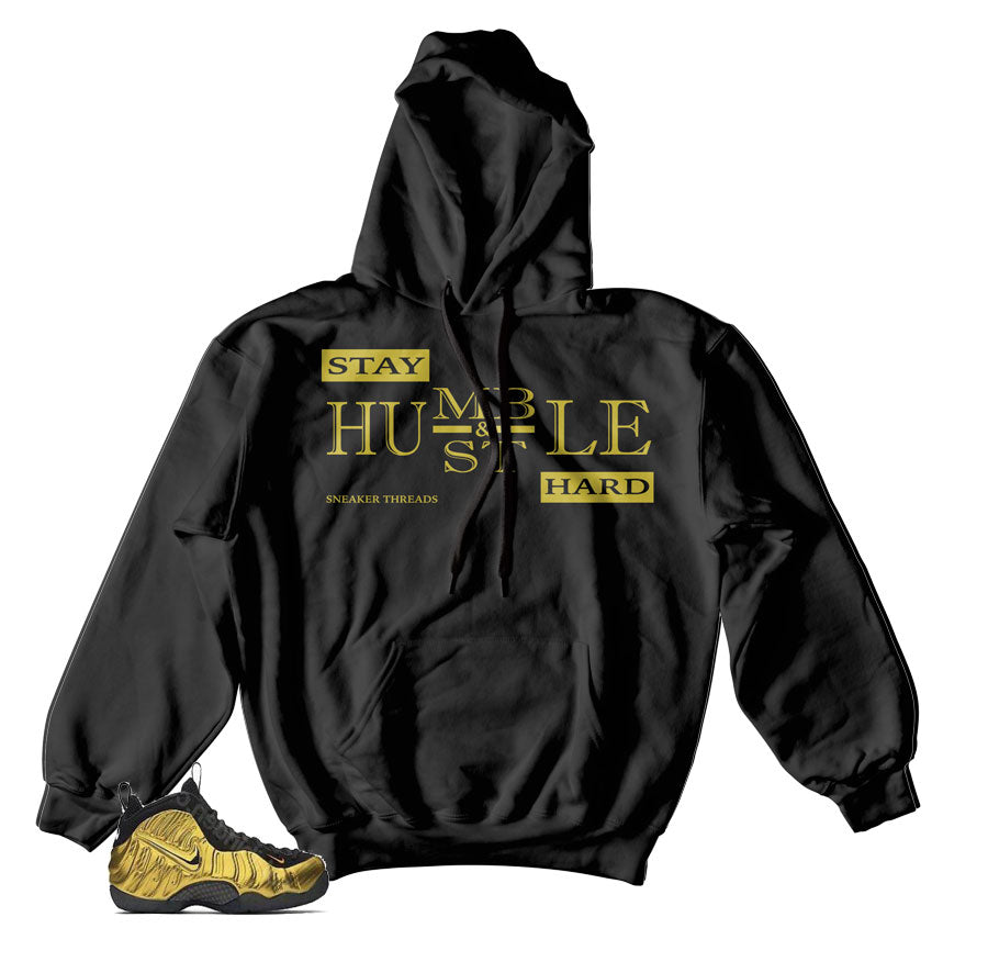 Hoodies match foamposite metallic gold shoes.