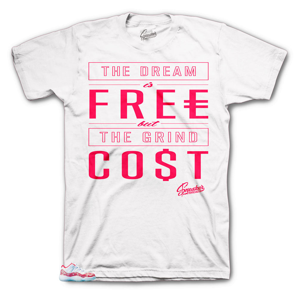 Jordan 11 pink snake skin low sneaker has matching tees created to match the Jordan 11 lo pink