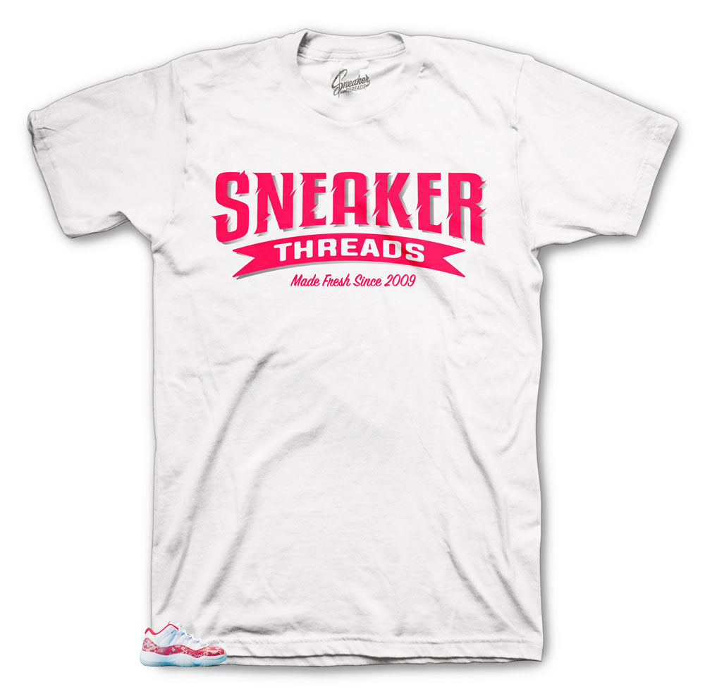 Jordan 11 Low snakeskin pink shoes match shirts made to match perfectly with the Jordan pink snaking 11s