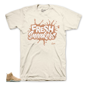 Jordan 12 vachetta tan sneaker match tees.